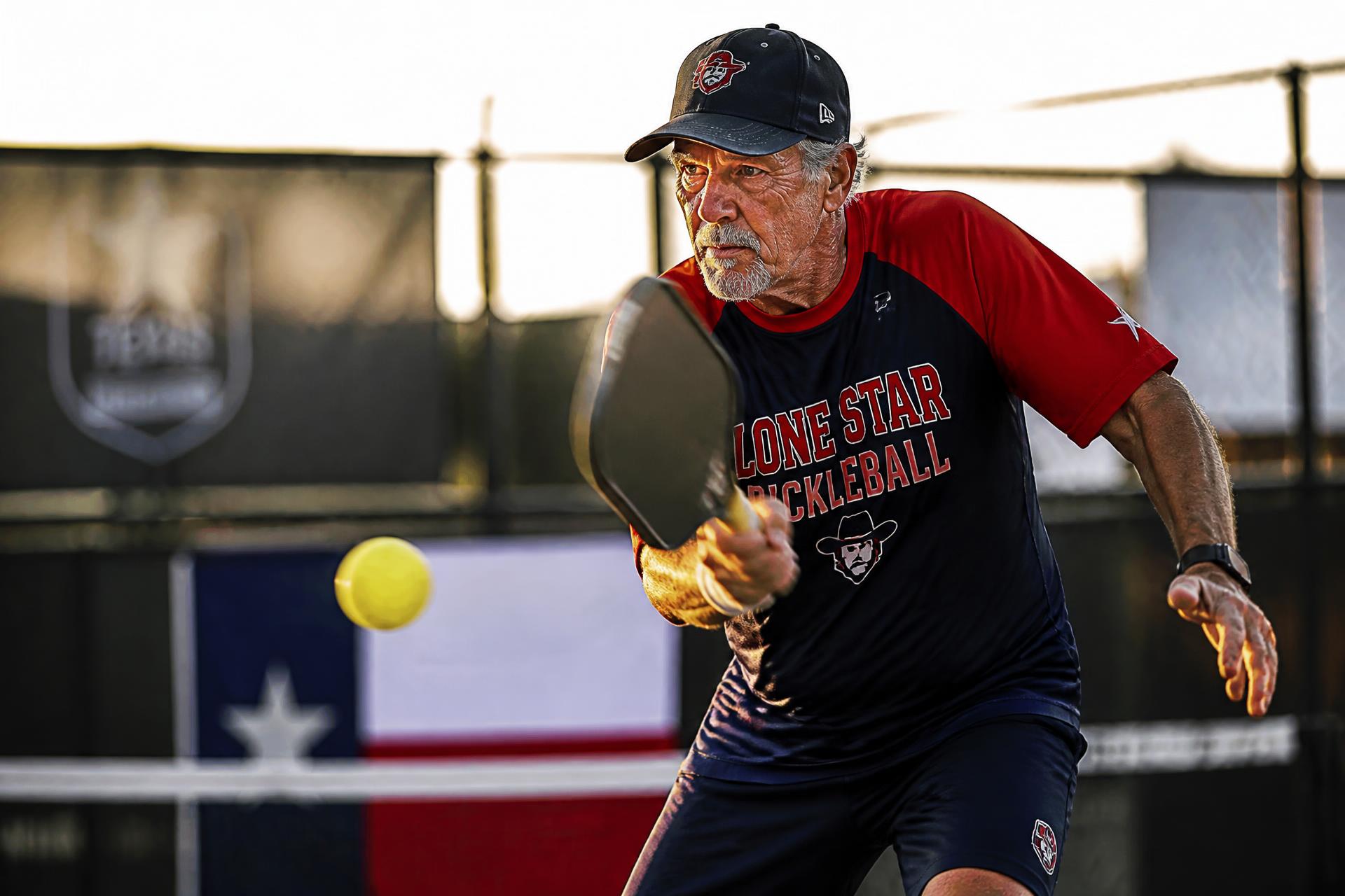 Texas Stars senior pro pickleball player mid-swing